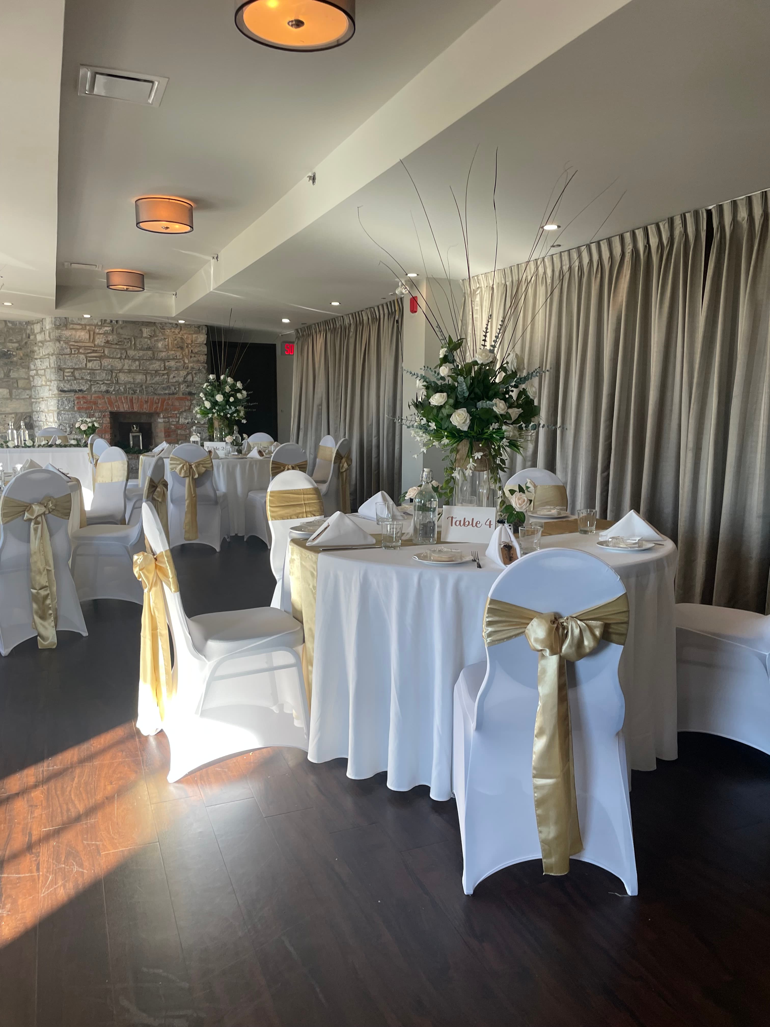 Tables dressed in white and gold in the Gold Room